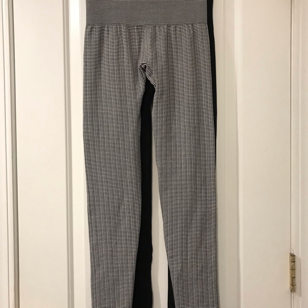 Two (2) Pairs of Stretch Leggings,  1 Black and White, 1 Black .  S/M size